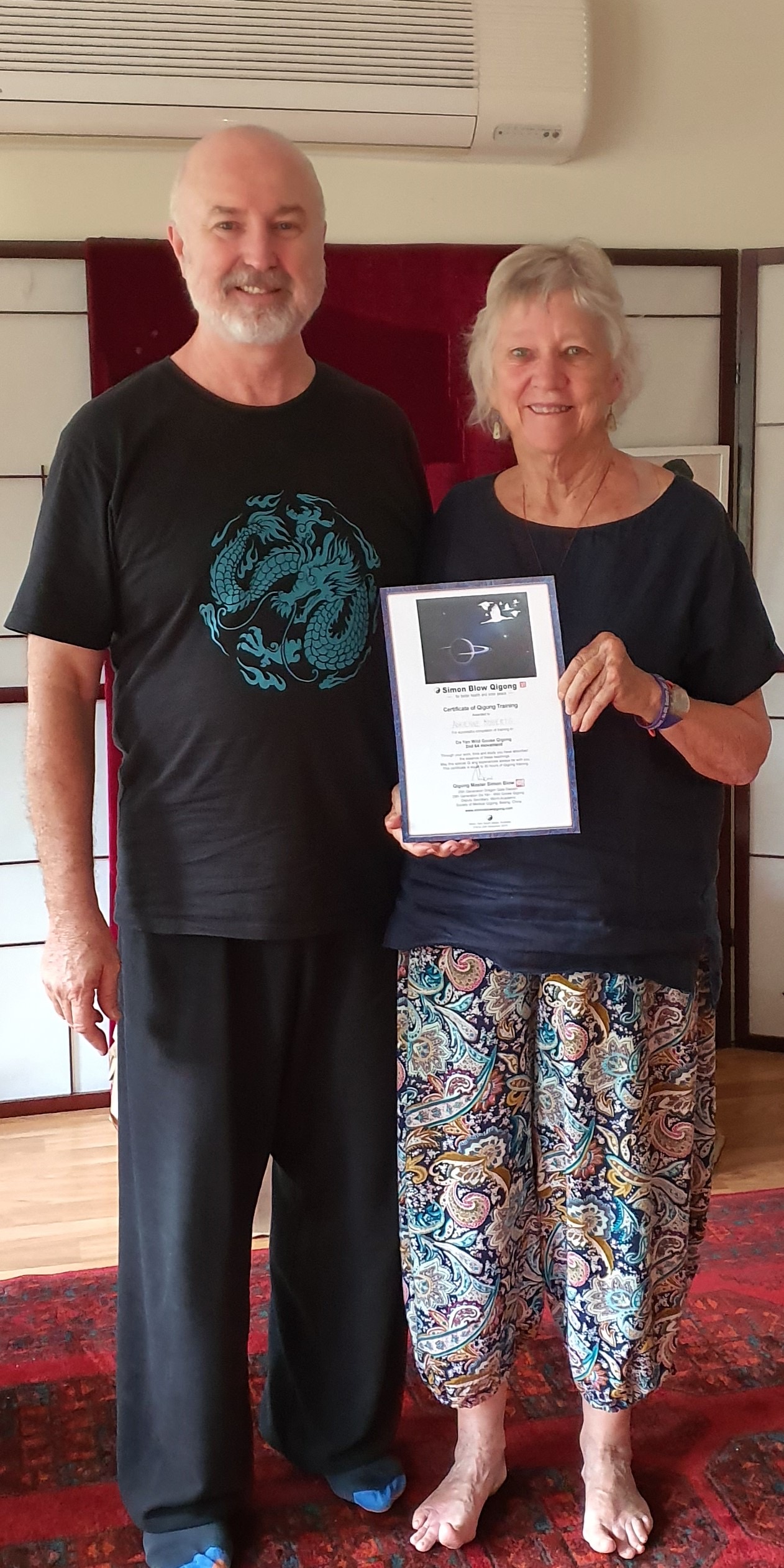 Adrienne with Master Simon receiving Da Yan 2 certificate